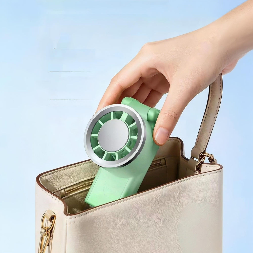 TurboBreeze portable handheld fan fits easily inside a handbag - compact travel size